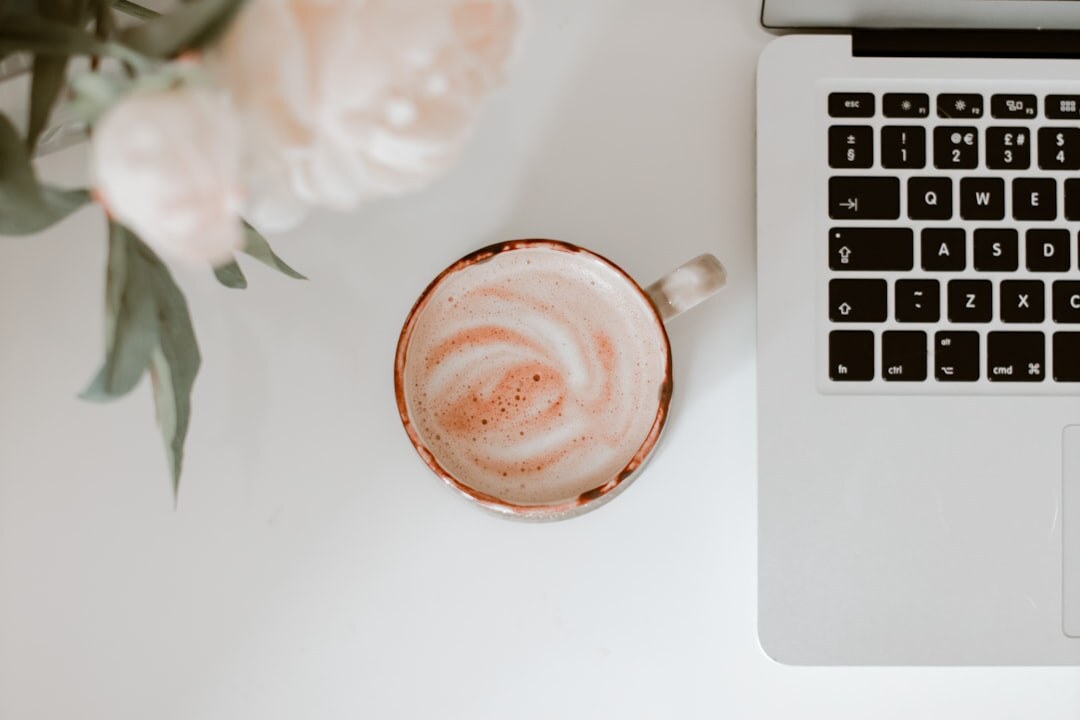 Remote work setup with laptop and coffee