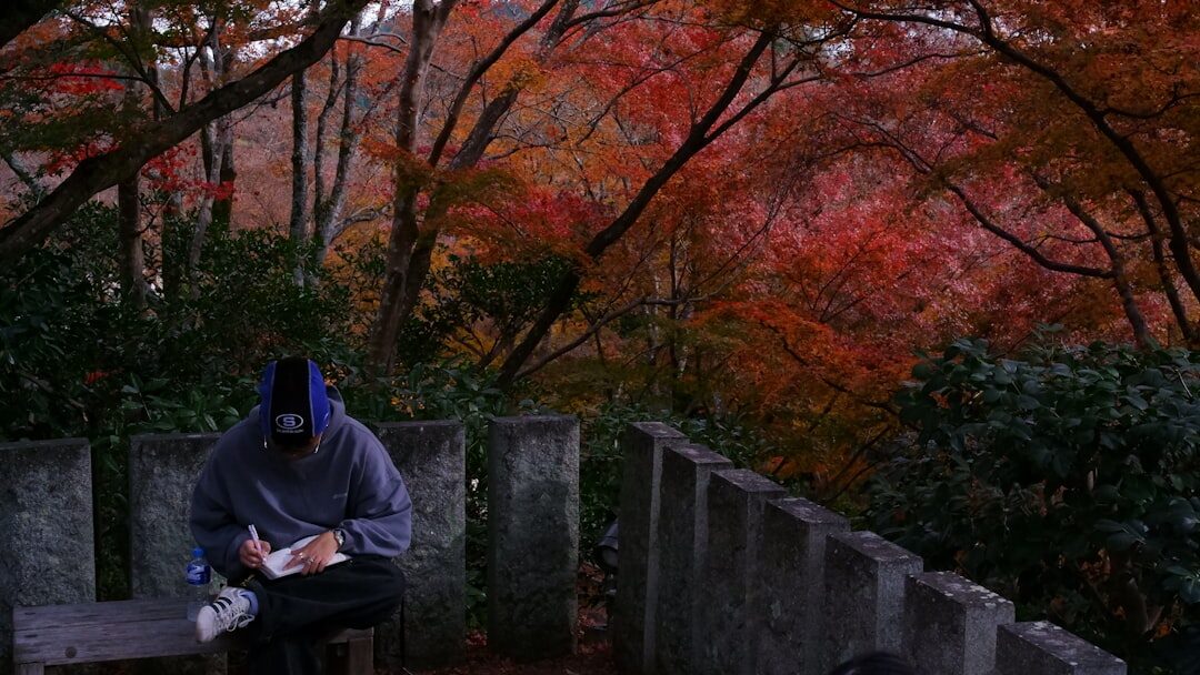 person writing in notebook